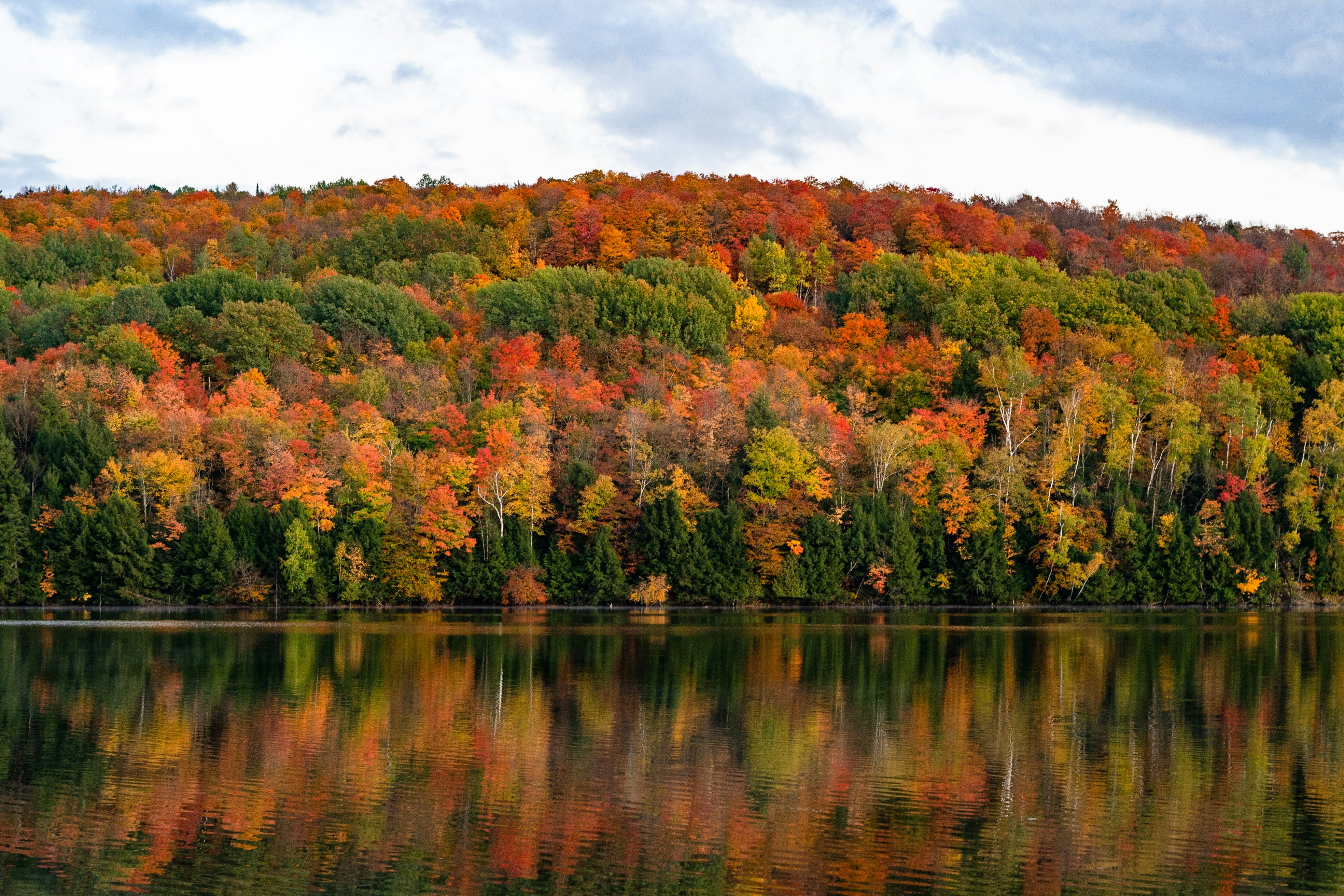 Vermont fall colors reflecting on a calm lake